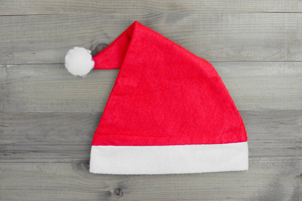 Christmas hat on vintage wood background - Photo, Image