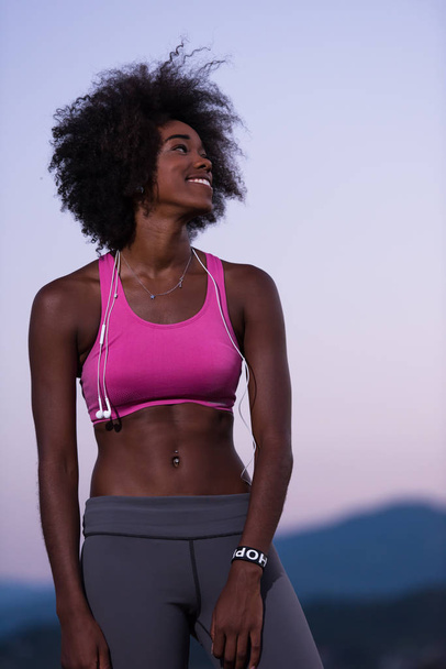 portrait of african american woman jogging in nature - Photo, Image