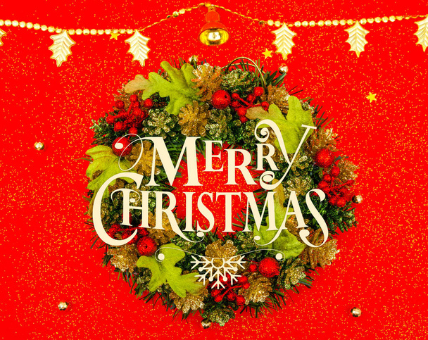 Christmas wreath  on red background . - Foto, afbeelding