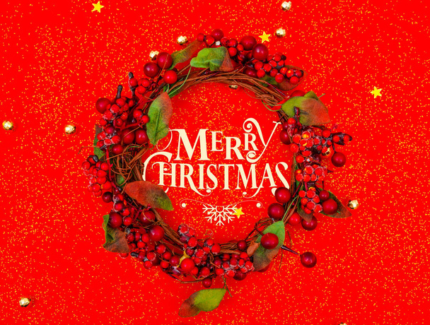 Christmas wreath  on red background . - Foto, afbeelding