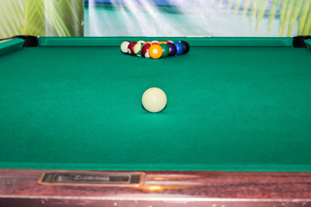 Billiard balls on green table and white ball - Photo, Image