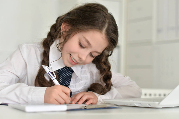 little girl doing homework - Фото, изображение