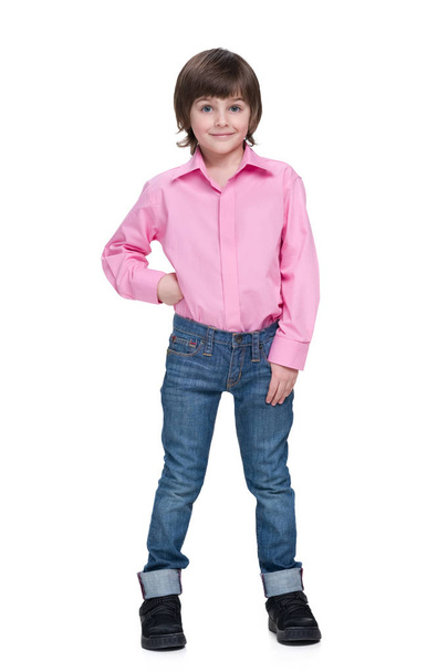 Fashion little boy stands against the white - Foto, imagen