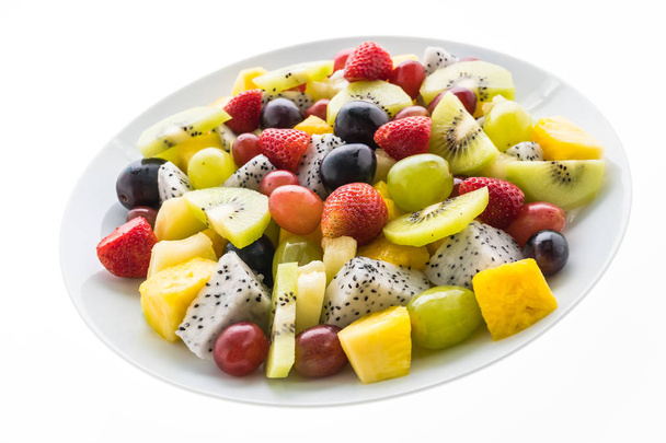 Fruta mixta en plato blanco
 - Foto, Imagen