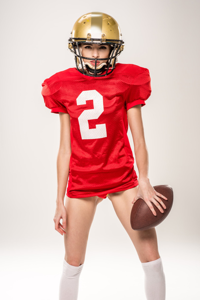 Beautiful female american football player  - 写真・画像
