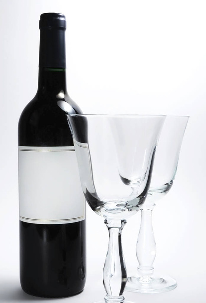 Bordeaux wine and elegant wine glasses - Фото, изображение