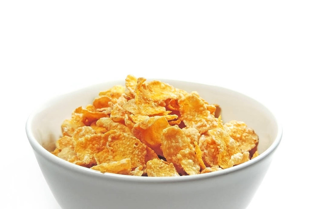 cornflakes in een witte kom - Foto, afbeelding