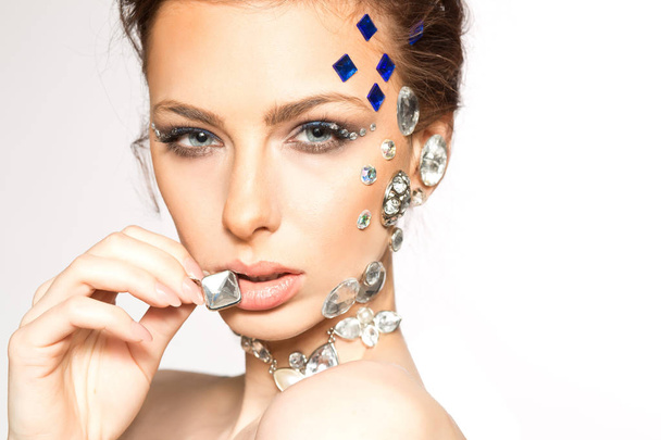 portrait of beautiful girl with diamonds on her face - Photo, Image
