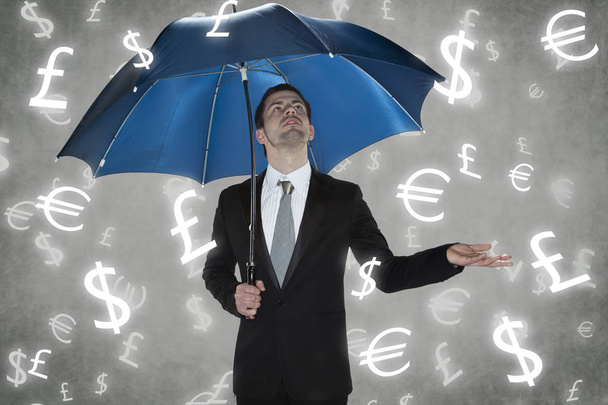 businessman under the rain currencies - Foto, imagen