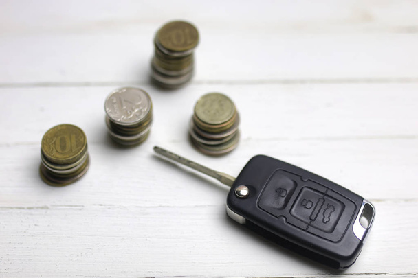 car key and coin on background - Fotoğraf, Görsel