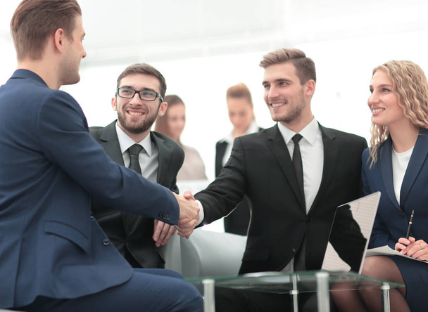 Businessman by handshake invites to cooperation. - Photo, Image