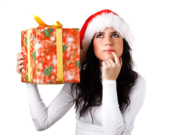 Красивая девушка в шляпе Санта-Клауса с подарком
 - Фото, изображение