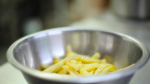 a cook pickles sliced potatoes - Felvétel, videó