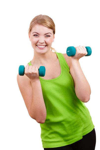 Woman exercising with dumbbells lifting weights  - Foto, Imagen