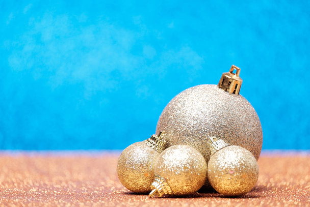 Christmas decorations on a glitter background - Фото, зображення