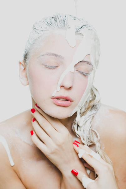 woman portrait with flowing white paint and face art - Foto, imagen