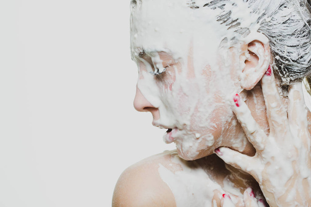woman portrait with flowing white paint and face art - Foto, Imagen