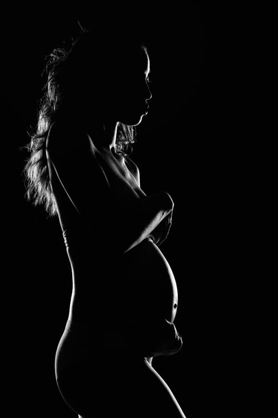 Silhouette Of Beautiful Pregnant African American Woman - Фото, изображение