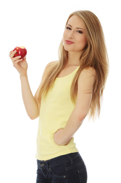 Young beautiful woman with an apple - Zdjęcie, obraz