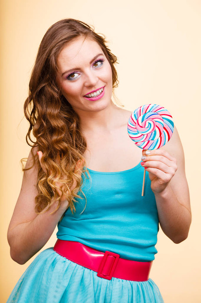 Woman joyful girl with lollipop candy - 写真・画像