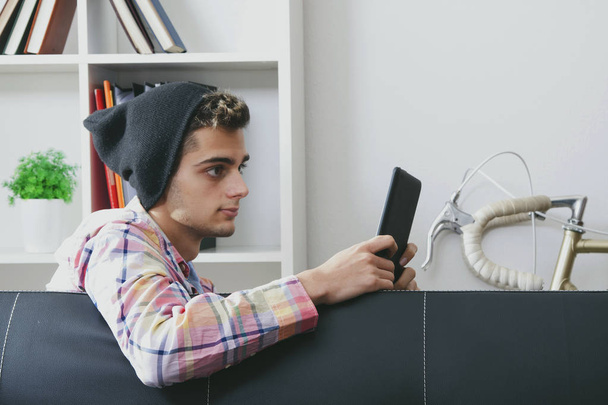 teen man with tablet  - Фото, изображение