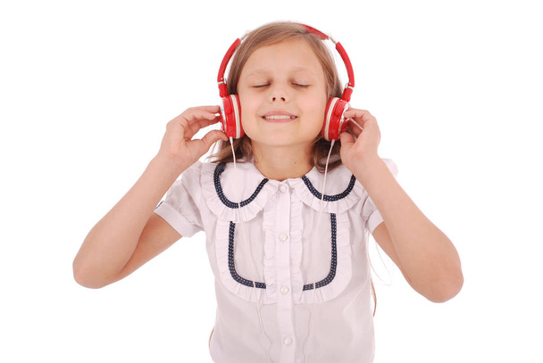 Happy young girl listening to music - Photo, Image