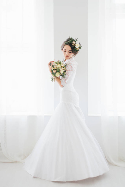 Beautiful happy young bride waiting for groom.  - 写真・画像