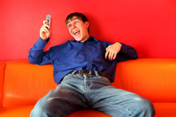 Happy teenager with phone - Foto, immagini