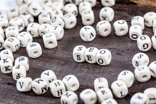 Word SEO on old wooden table. - Photo, Image