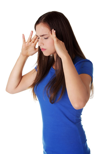 Mujer adolescente con dolor de cabeza
 - Foto, Imagen