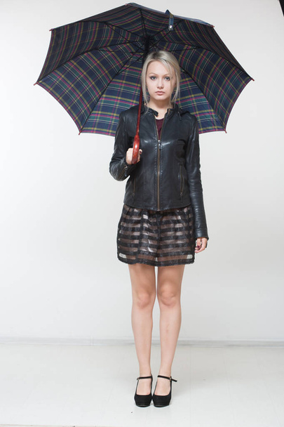 female with black umbrella, full length, white background - Foto, Imagen