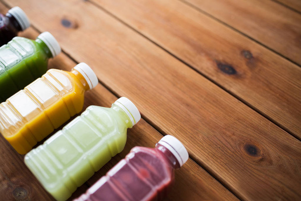 bottles with different fruit or vegetable juices - Fotografie, Obrázek