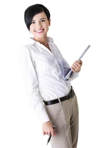 Happy smiling business woman holding notebook and pen - Foto, Bild