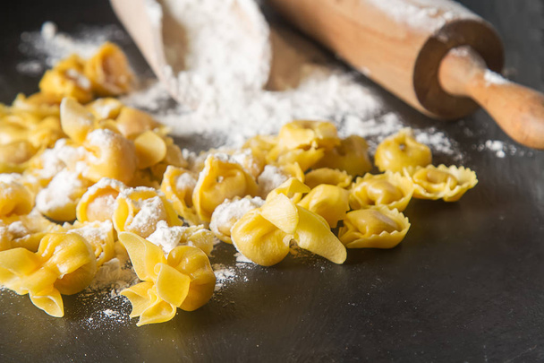 Italian traditional food. Home-made ravioli with cheese and herb - 写真・画像