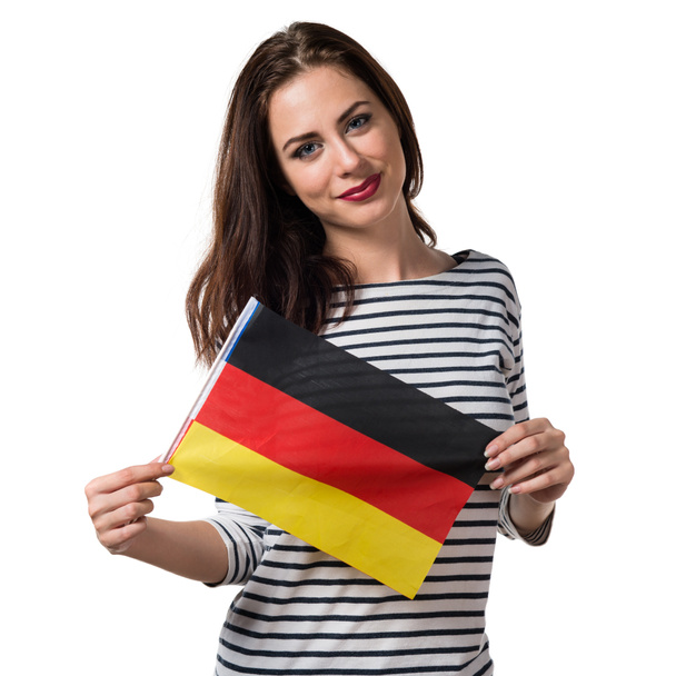 Pretty young girl holding a germany flag - Fotografie, Obrázek