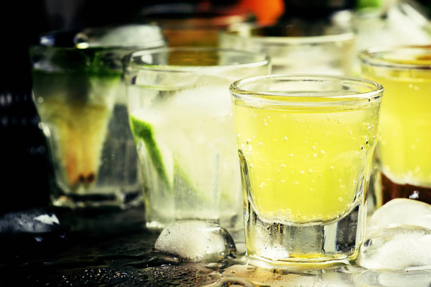 Various cocktails with fruit juice and alcohol - Fotó, kép