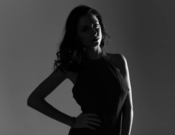 Brunette model woman posing in studio in black and white - Photo, Image