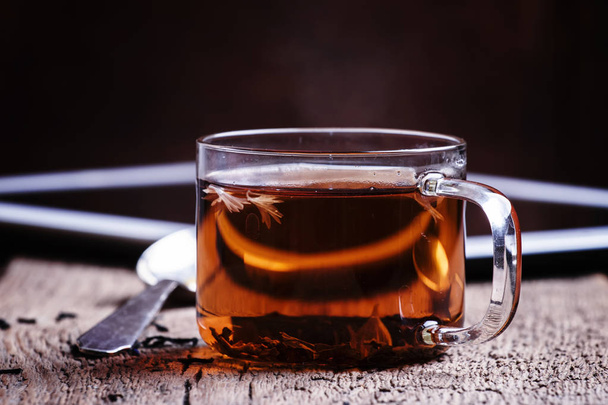 Cup of hot tea and tablet  - Фото, изображение