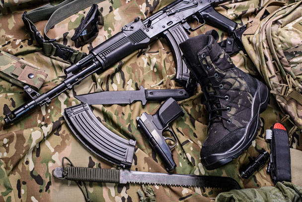Army boot and different weapon - Photo, Image