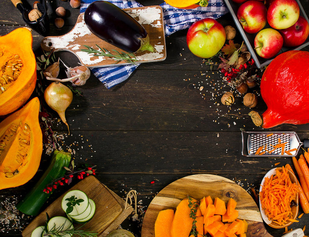 Autumn vegetables and fruits on a dark wooden board.  - Foto, Bild