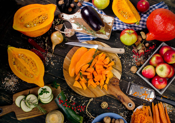 Autumn vegetables and fruits on a dark wooden background.  - Foto, Bild