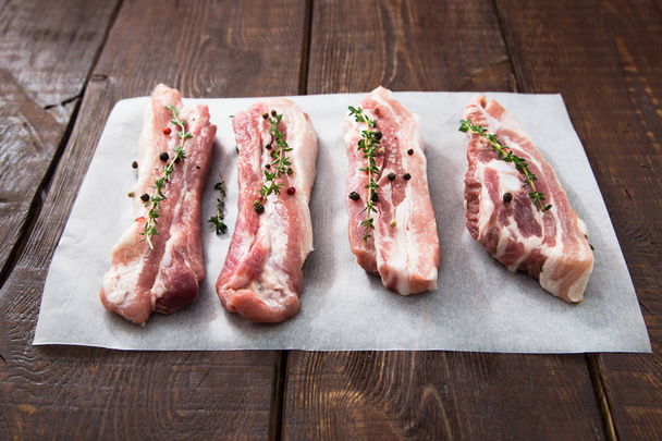Raw meat. Pork ribs with herbs and spices - Photo, Image