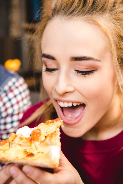 Woman eating pizza  - Photo, Image