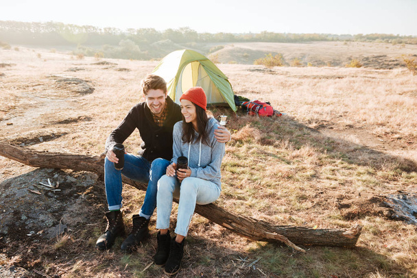 Young couple near the tent - Φωτογραφία, εικόνα