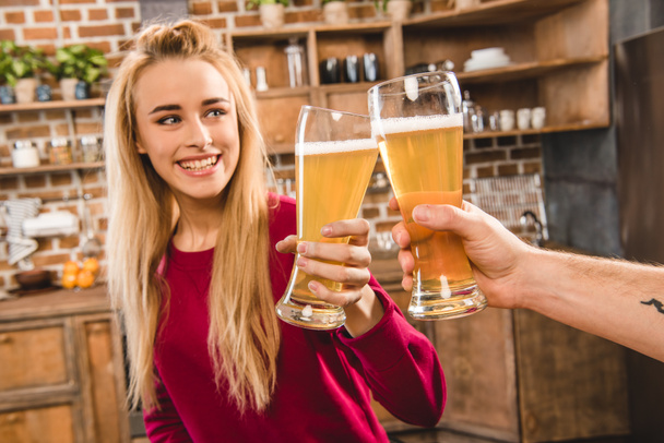 Woman toasting with beer - Photo, Image