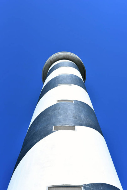 Black and white striped lighthouse or beacon - Φωτογραφία, εικόνα