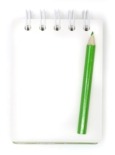 Green pencils and notebook on a white background - 写真・画像