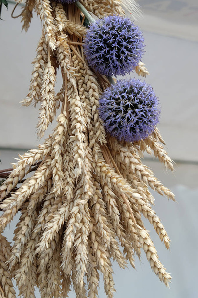 Bundle of wheat with flower - Photo, Image