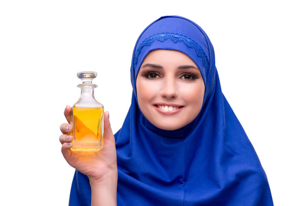 Arabian woman with bottle of perfume isolated on white - Photo, Image
