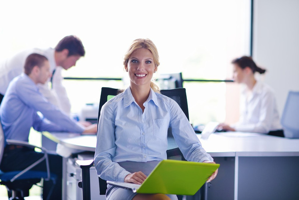 business woman with her staff in background at office - Photo, Image